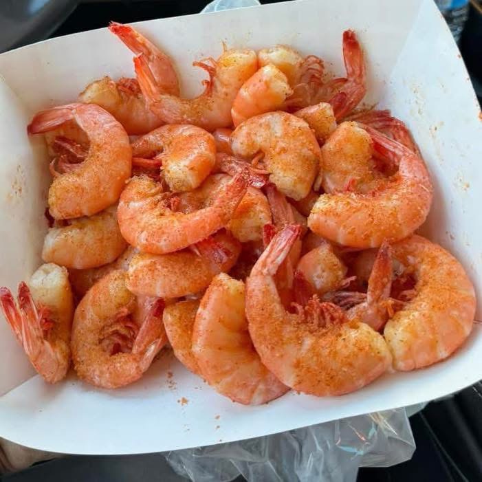 Seasoned boiled Gulf shrimp in a paper tray